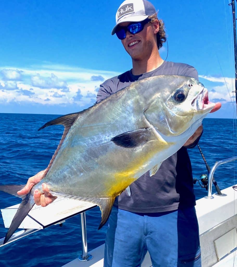Fisherman holding permit caught on deep sea fishing charter