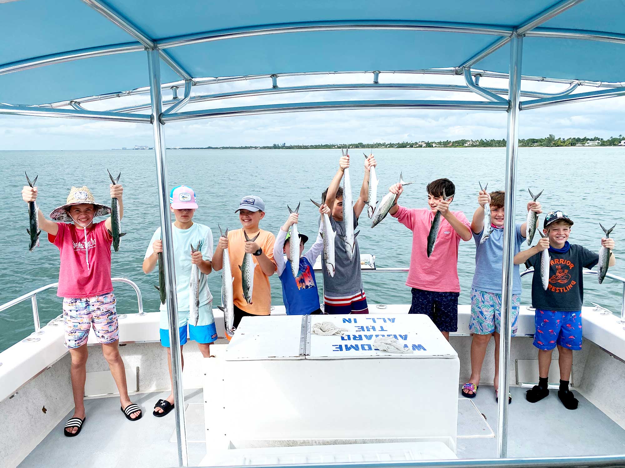 Young anglers holding Mackerel
